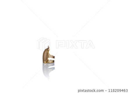 thimble and needle and thread on a white background 118209463