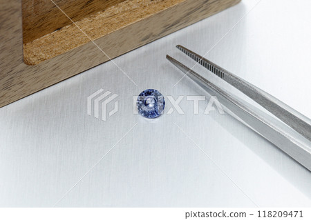 macro mineral faceted stone Sapphire on a gray background macro mineral faceted stone Sapphire on a gray background 118209471