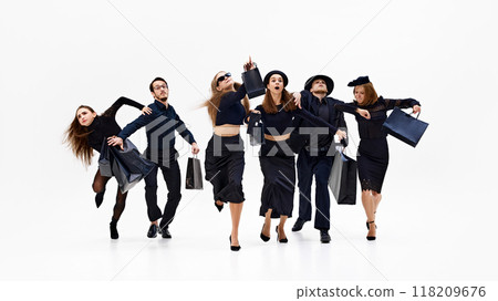 Group in mid-motion, with some pointing forward as if heading toward something important against white studio background. 118209676