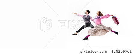 Banner. Leaping in sync, woman and man hold hands and shopping bags against white background with negative space to insert text. 118209761