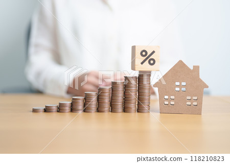 block of percentage with Home model and money coins stack. Real estate Mortgage, Refinance, House loan and debt, Interest rate, Insurance, Financial and Property Tax concepts block of percentage with Home model and money coins stack. Real estate Mortgage, Refinance, House loan and debt, Interest rate, Insurance, Financial and Property Tax concepts 118210823