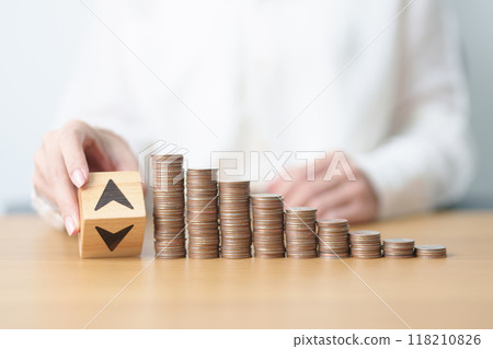 wood block of Arrow change to UP and Down with money coins stack. Interest rate, GDP, stocks market, financial, deflation and Inflation, ranking, mortgage, debt, Loan and Economic Recession wood block of Arrow change to UP and Down with money coins stack. Interest rate, GDP, stocks market, financial, deflation and Inflation, ranking, mortgage, debt, Loan and Economic Recession 118210826