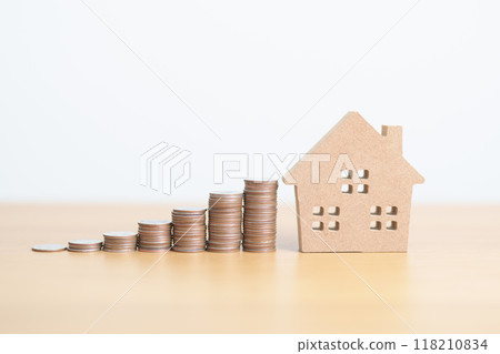 Money Saving, Property investment, House Mortgage and Real Estate Financial concepts. coins stack with Home model, Money stack Counting arrangement for deposit and Tax 118210834