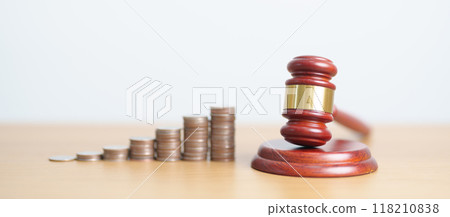 judge gavel with money coins stack on desk. Law cost, lawyer, judgment, justice auction and bidding concepts judge gavel with money coins stack on desk. Law cost, lawyer, judgment, justice auction and bidding concepts 118210838