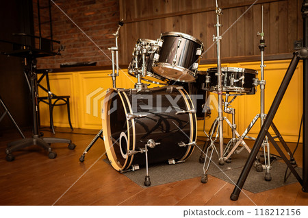 Drum set on stage in a recording studio. Musical instruments. 118212156