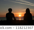 Couple watching the sunset 118212307