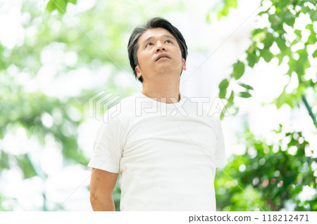 Senior man stretching in the park 118212471