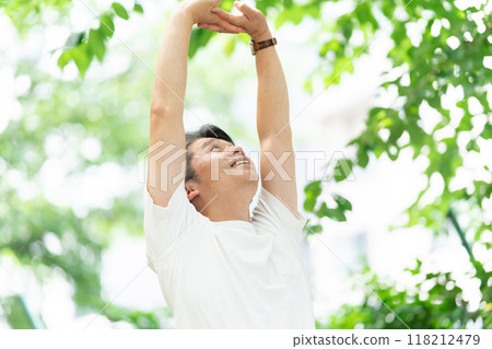 Senior man stretching in the park Senior man stretching in the park 118212479