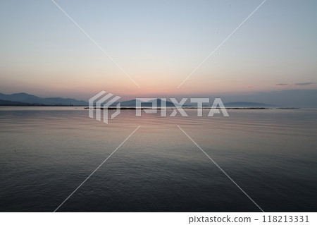 Calm sea before sunset Calm sea before sunset 118213331
