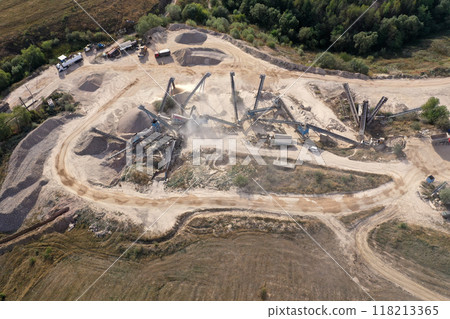 Aerial view of a stone quarry with working stone crushing machines 118213365