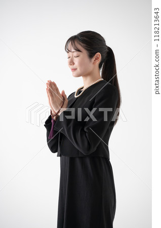A woman in a mourning clothes A woman in a mourning clothes 118213643