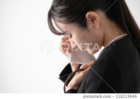 A woman in a mourning clothes A woman in a mourning clothes 118213649