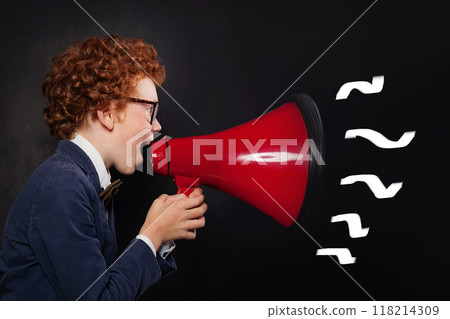 Child screaming red megaphone on black background Child screaming red megaphone on black background 118214309