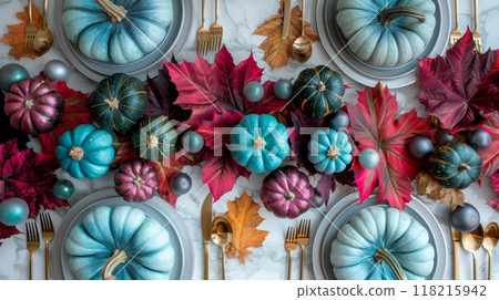 Thanksgiving decorations with teal pumpkins, magenta leaves, metallic gold accents. Top view image 118215942