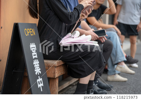 People lining up at a popular restaurant 118215973