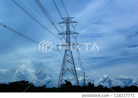 electricity transmission pylon silhouetted 118217771
