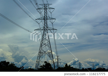 electricity transmission pylon silhouetted 118217775