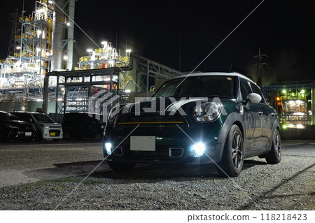 An imported car parked on a road in a factory district 118218423