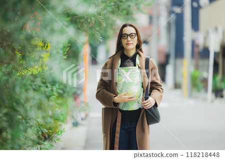 Mother walking with baby Mother walking with baby 118218448