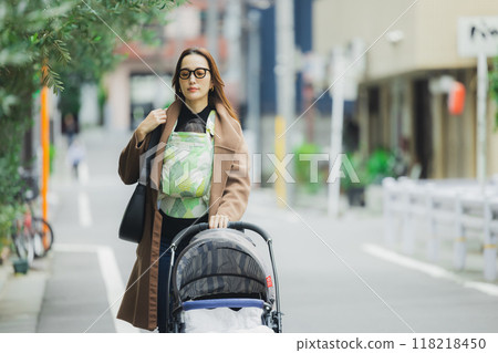 Mother walking with baby 118218450