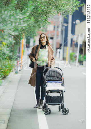 Mother walking with baby Mother walking with baby 118218452