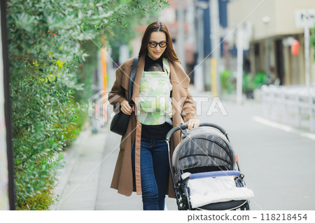 Mother walking with baby 118218454