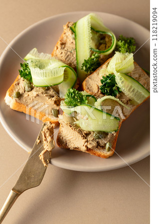 Open pate sandwiches with fresh cucumber, capers, and parsley. Open pate sandwiches with fresh cucumber, capers, and parsley. 118219094