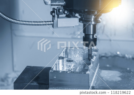 The CNC milling machine chamfer cutting aluminum part by chamfer tool in the light blue scene. 118219622