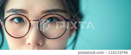Close up portrait of young woman with glasses. Wide banner, copy space for text. Various projects. Beautiful girl wearing eyeglasses. Portrait of Asian lady in glasses satisfied ophthalmology service Close up portrait of young woman with glasses. Wide banner, copy space for text. Various projects. Beautiful girl wearing eyeglasses. Portrait of Asian lady in glasses satisfied ophthalmology service 118219746