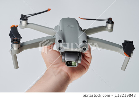 Hand holding unfolded drone Hand holding unfolded drone 118219848