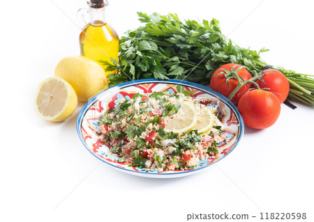 Tabbouleh salad with couscous isolated on white background Tabbouleh salad with couscous isolated on white background 118220598