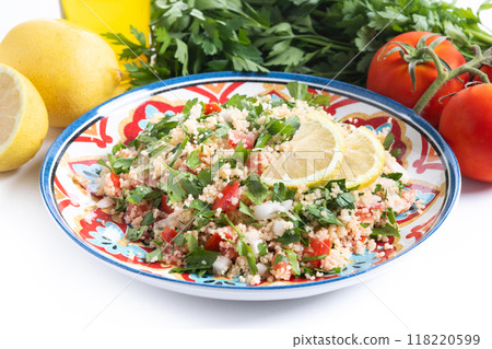 Tabbouleh salad with couscous isolated on white background Tabbouleh salad with couscous isolated on white background 118220599