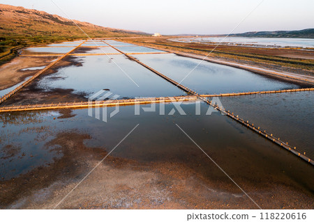 Shallow basins for sea salt production on Pag island in Croatia. Specialized equipment to produce natural product using traditional method Shallow basins for sea salt production on Pag island in Croatia. Specialized equipment to produce natural product using traditional method 118220616