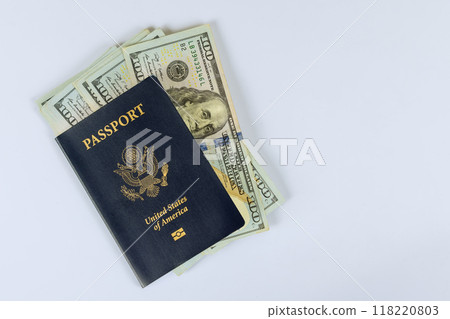 American passport on top of American dollar cash banknotes 118220803