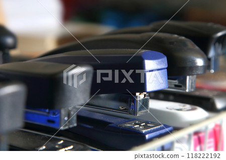 Staplers in different colors and sizes. School supplies, stationery accessories. Colorful stationery. Goods for office and study. Staplers in different colors and sizes. School supplies, stationery accessories. Colorful stationery. Goods for office and study. 118222192