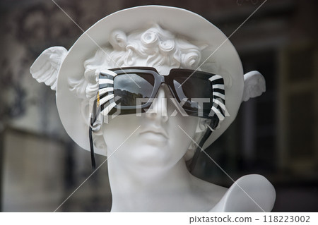 Closeup of sun glasses on mannequin in an optician store showroom Closeup of sun glasses on mannequin in an optician store showroom 118223002