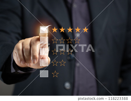 Man rates satisfaction using rating star on virtual screen. Concept of service satisfaction, survey, five star rating, highest satisfaction. Success business, quality service, survey feedback. Man rates satisfaction using rating star on virtual screen. Concept of service satisfaction, survey, five star rating, highest satisfaction. Success business, quality service, survey feedback. 118223388