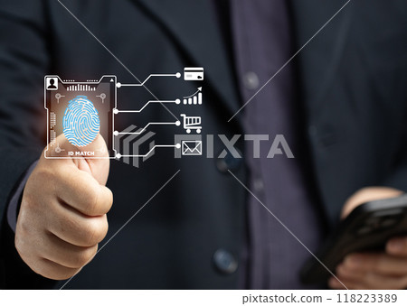 A man scans his fingerprint to verify his identity when making a business transaction on his smartphone, using a credit card online, shopping online, or encrypting the code to verify his email. A man scans his fingerprint to verify his identity when making a business transaction on his smartphone, using a credit card online, shopping online, or encrypting the code to verify his email. 118223389