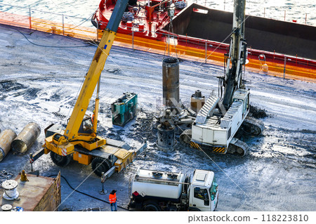 Installation of pile casings in the port quay, drilling rig, port infrastructure upgrade works 118223810