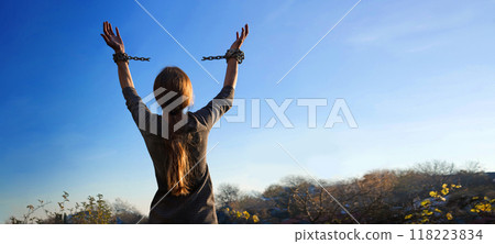 Tied hands raised to the sky Tied hands raised to the sky 118223834