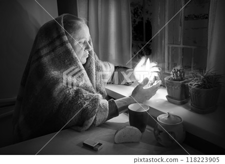 Woman with candles. Power outage in Kyiv Woman with candles. Power outage in Kyiv 118223905
