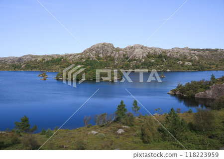 Lake Fossvatnet and anorthosite rock formations in late summer, Egersund, Norway. 118223959