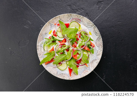 Fresh vegetable salad with arugula, cucumbers, tomatoes, and red onions - healthy food projects Fresh vegetable salad with arugula, cucumbers, tomatoes, and red onions - healthy food projects 118224570