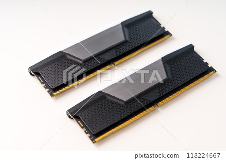 A Pair of Sleek Black and Gray Computer Memory RAM Sticks Isolated on a Clean White Background A Pair of Sleek Black and Gray Computer Memory RAM Sticks Isolated on a Clean White Background 118224667