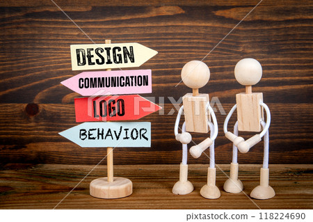 Corporate Identity. Miniature road sign arrows on wood texture background Corporate Identity. Miniature road sign arrows on wood texture background 118224690