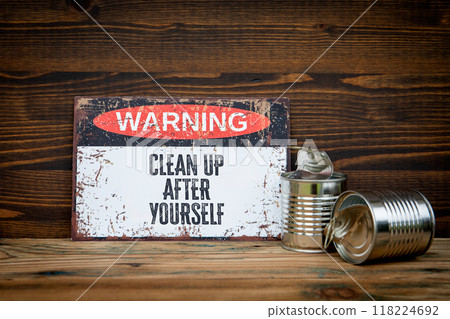 Clean up after yourself. Warning sign with text on wooden background Clean up after yourself. Warning sign with text on wooden background 118224692