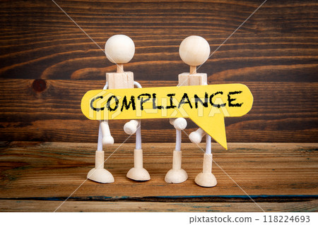 Compliance concept. Yellow speech bubble with word. Miniature human figures Compliance concept. Yellow speech bubble with word. Miniature human figures 118224693