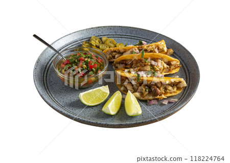 Delicious tacos filled with meat served on a plate. Delicious tacos filled with meat served on a plate. 118224764