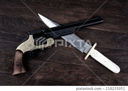 Old West Revolver with bowie knife on leather jacket 118225051