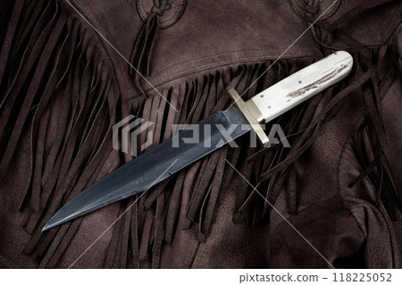 Old west bowie knife on leather jacket 118225052